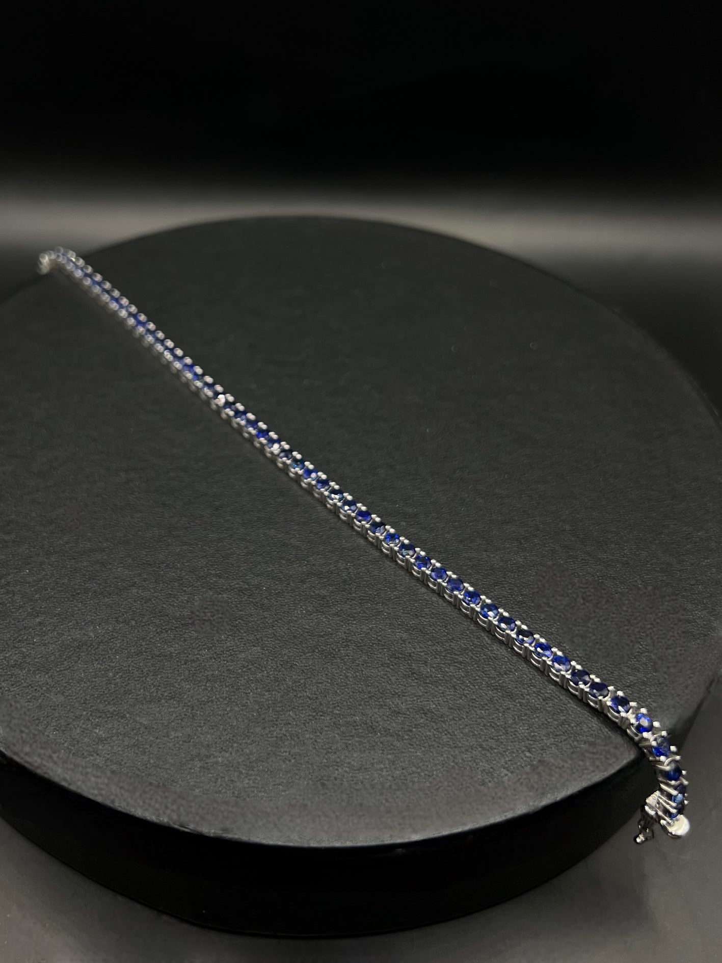 Tennis white gold bracelets with dark blue natural sapphires