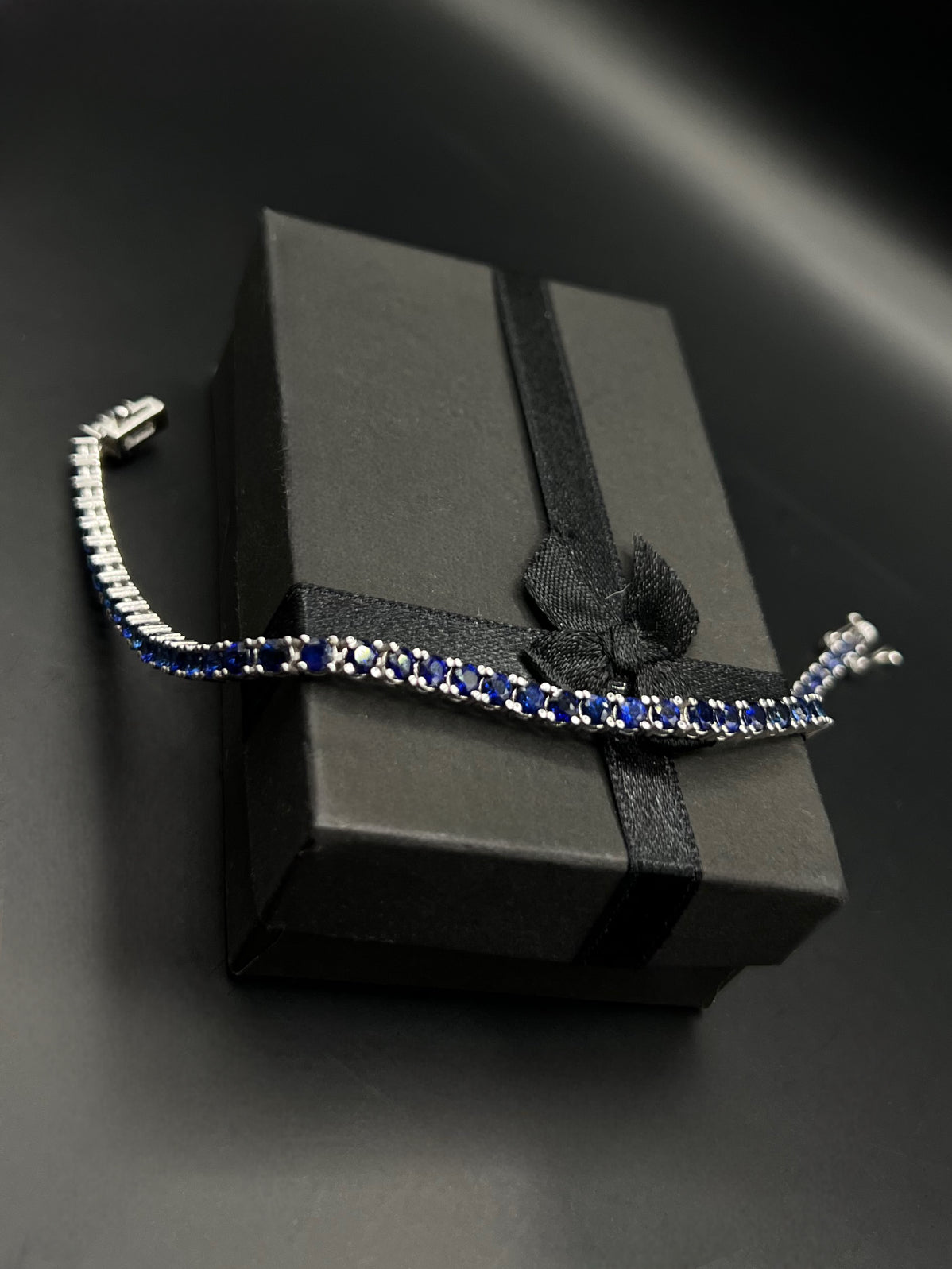 Tennis white gold bracelets with dark blue natural sapphires