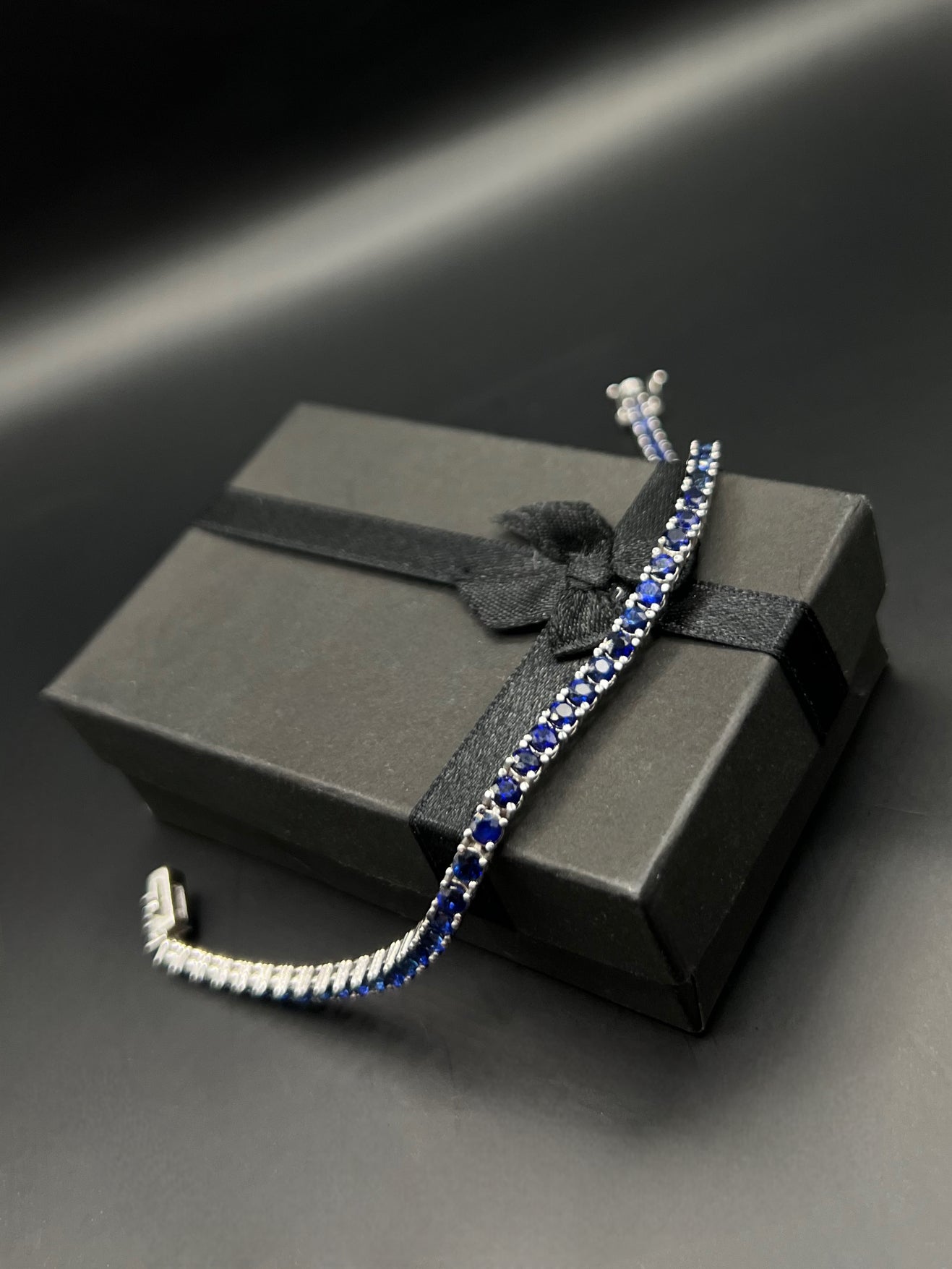 Tennis white gold bracelets with dark blue natural sapphires