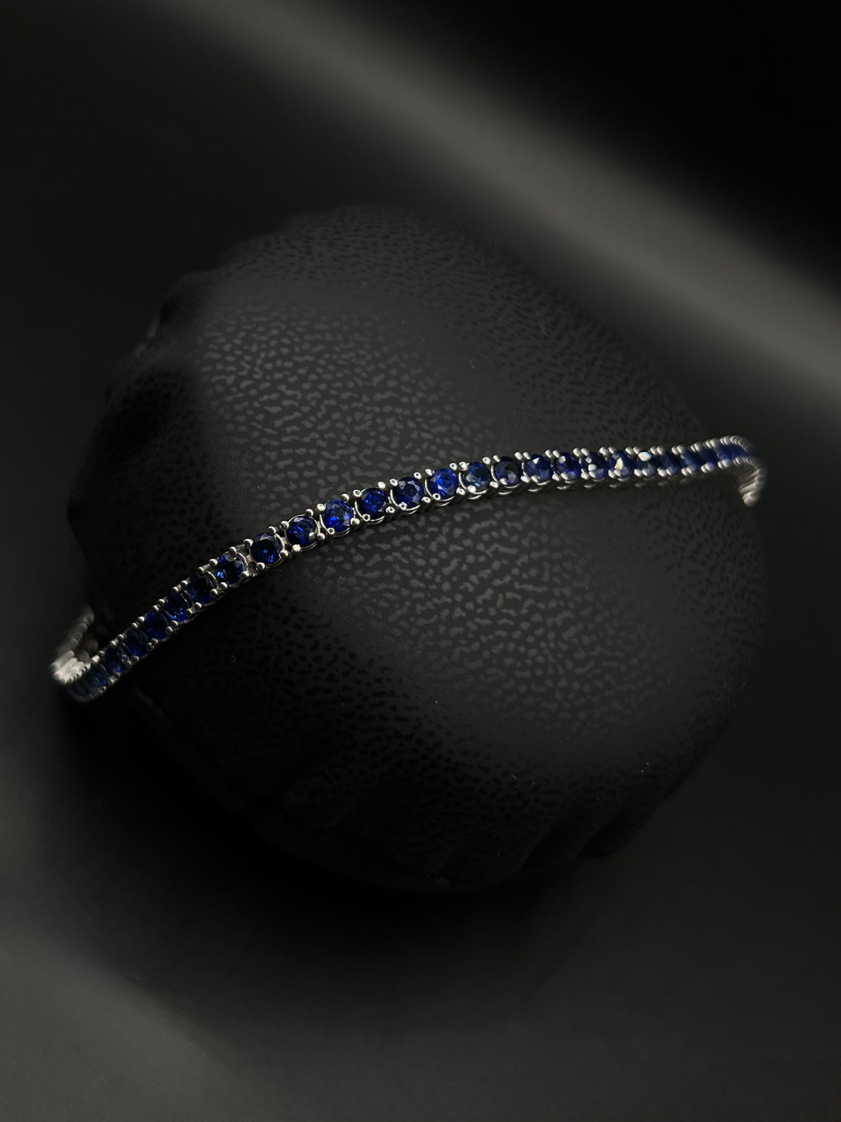 Tennis white gold bracelets with dark blue natural sapphires